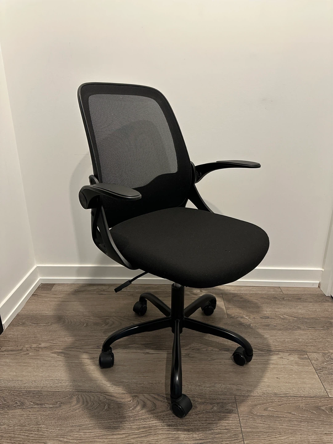 Black Mesh Office Chair with Flip-Up Arms