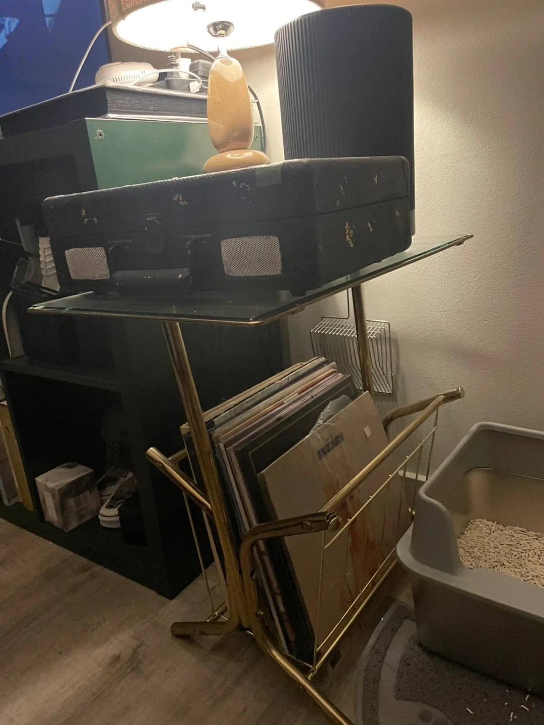 Gold tone glass top side table with magazine rack