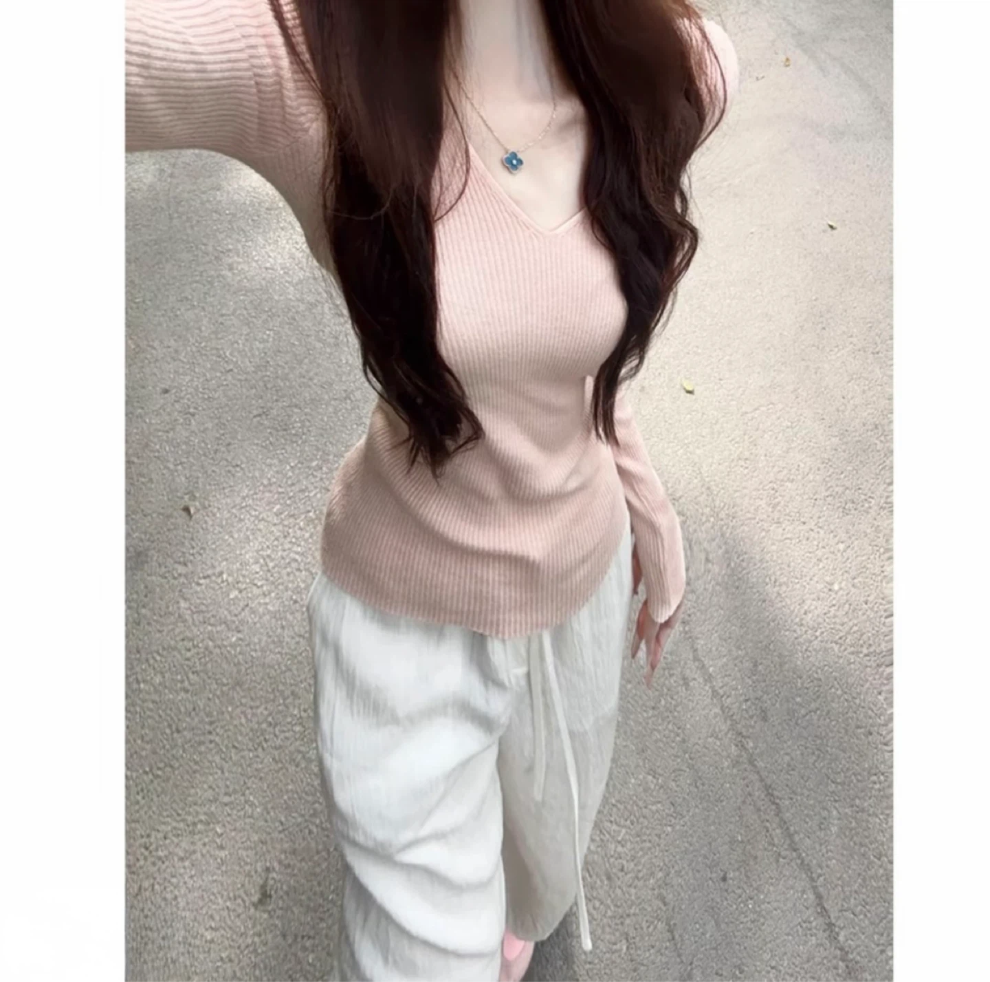 Pink ribbed v-neck sweater