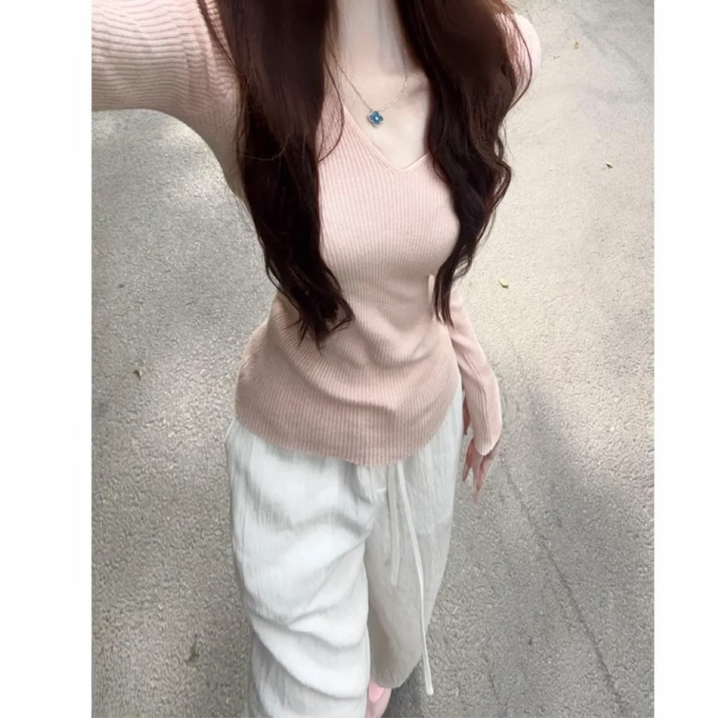 Pink ribbed v-neck sweater