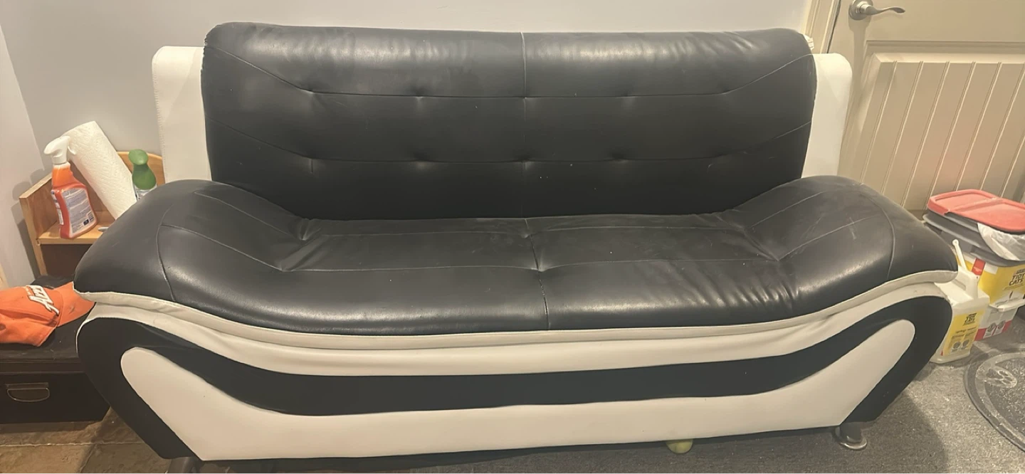 Black and white faux leather loveseat