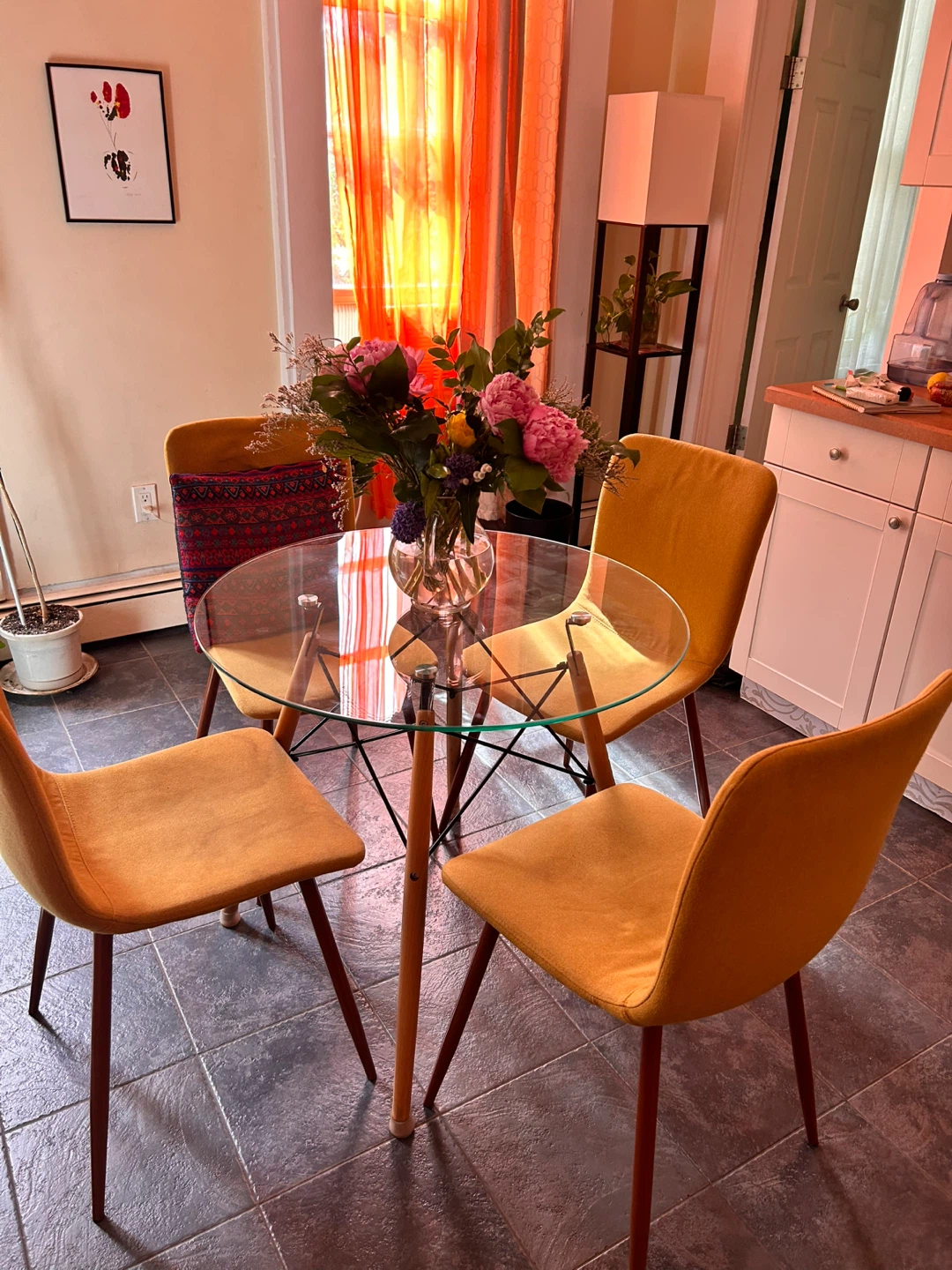 Glass top table 31 diameter and four yellow chairs