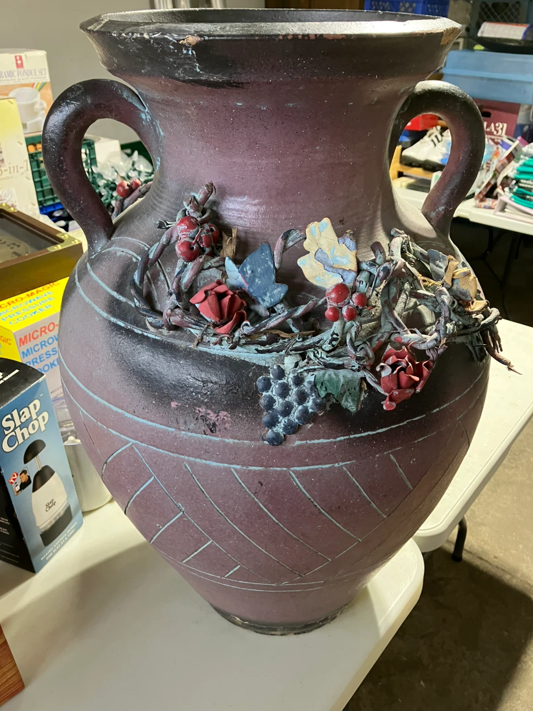 Large decorative vase with handles and applied floral design