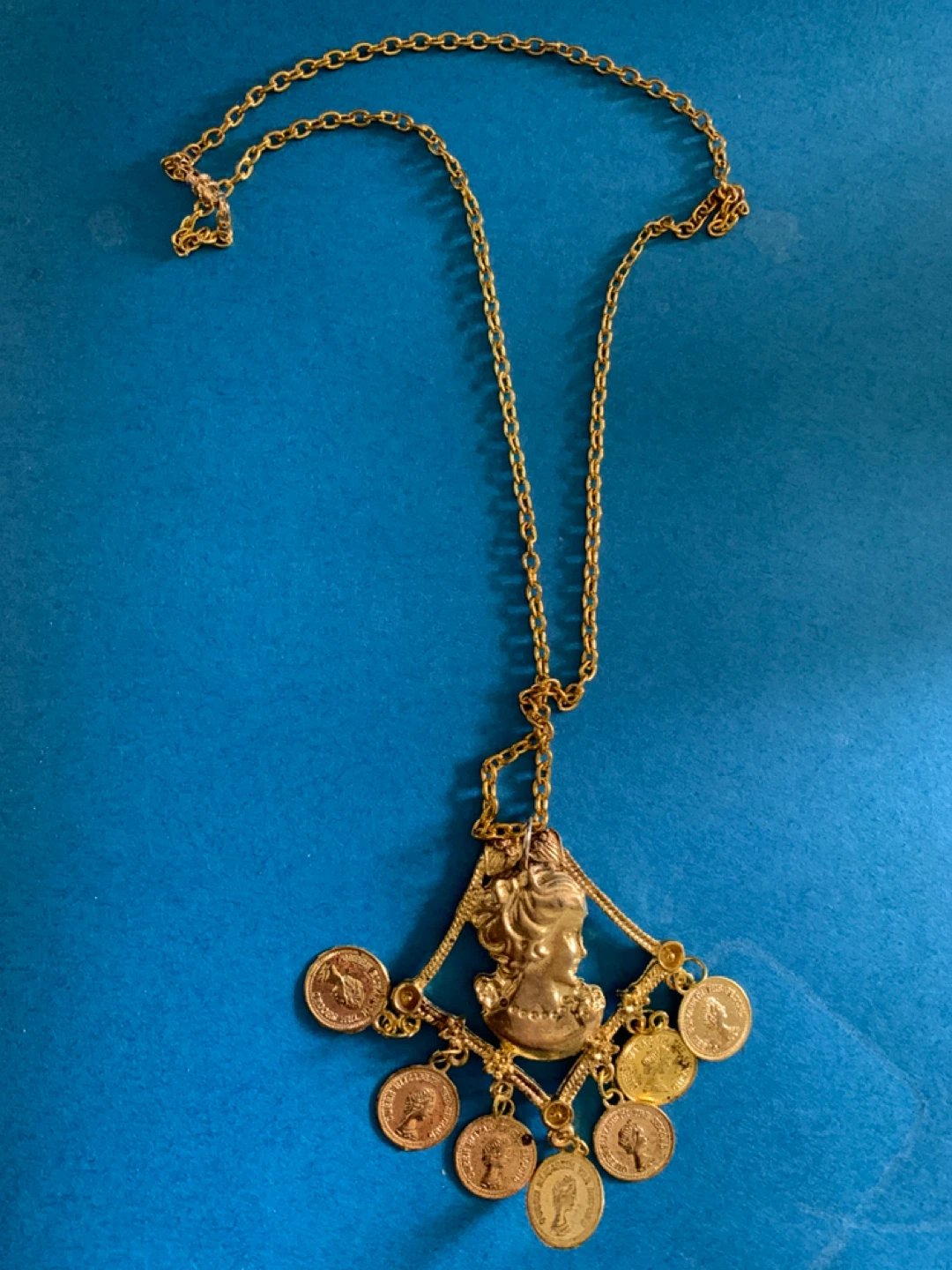 Gold-tone cameo and coin pendant necklace