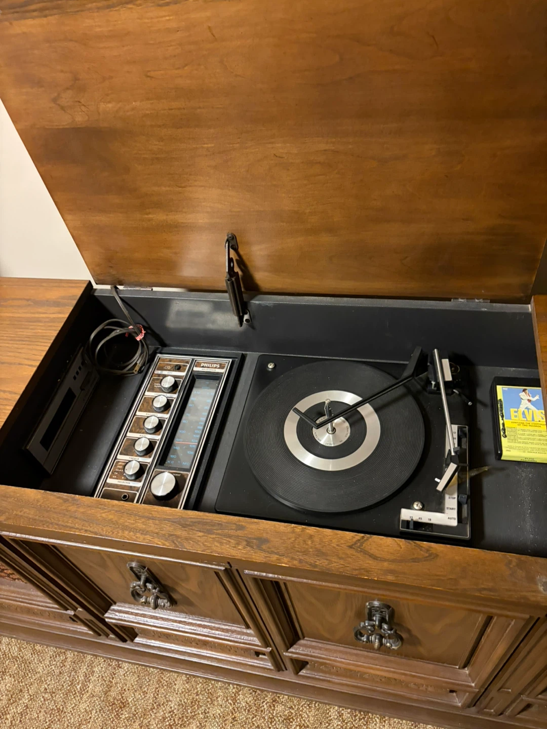 Stereo  has radio, turntable, 8 track