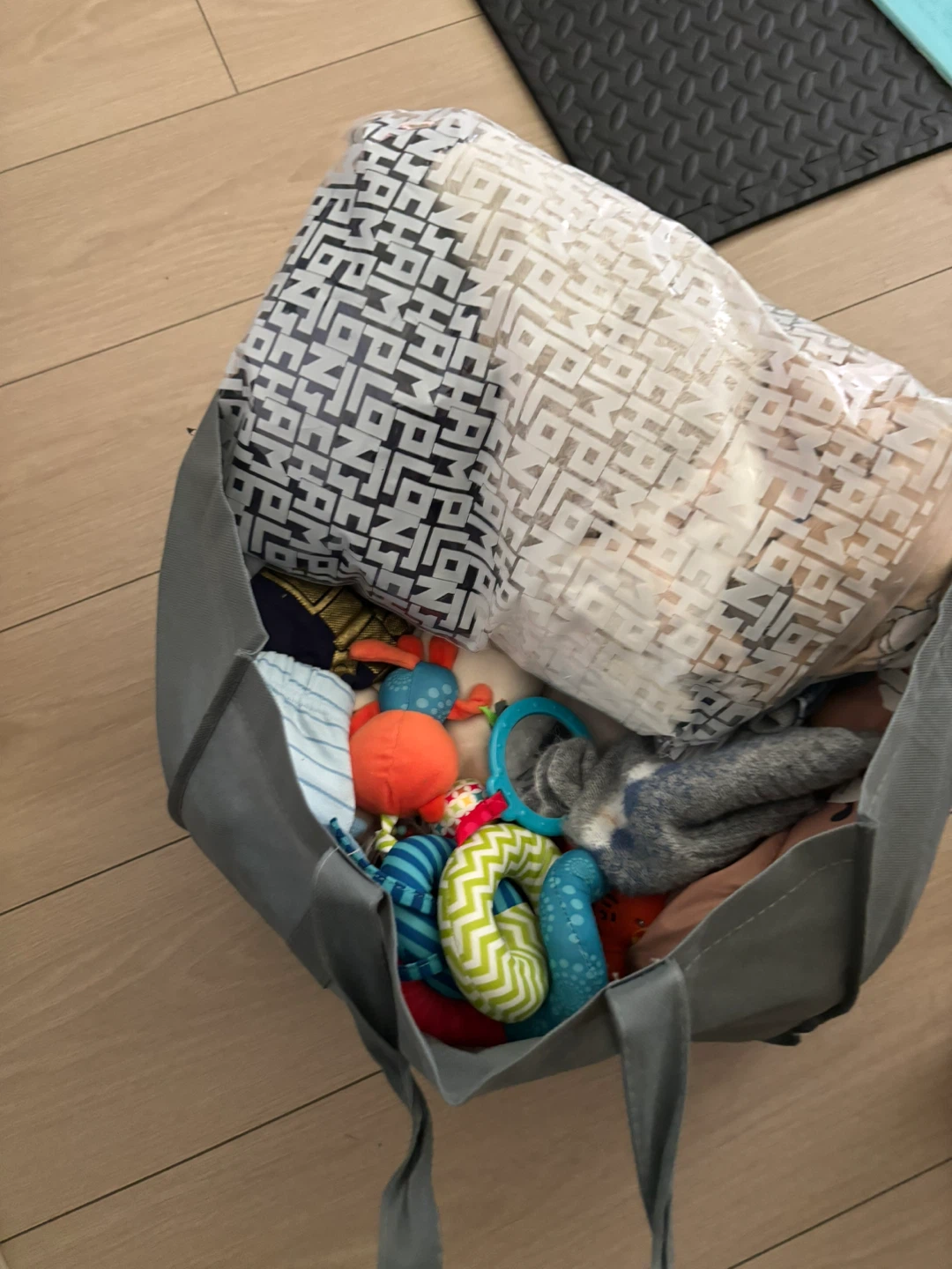 A bag full of baby BOY clothes and few toys