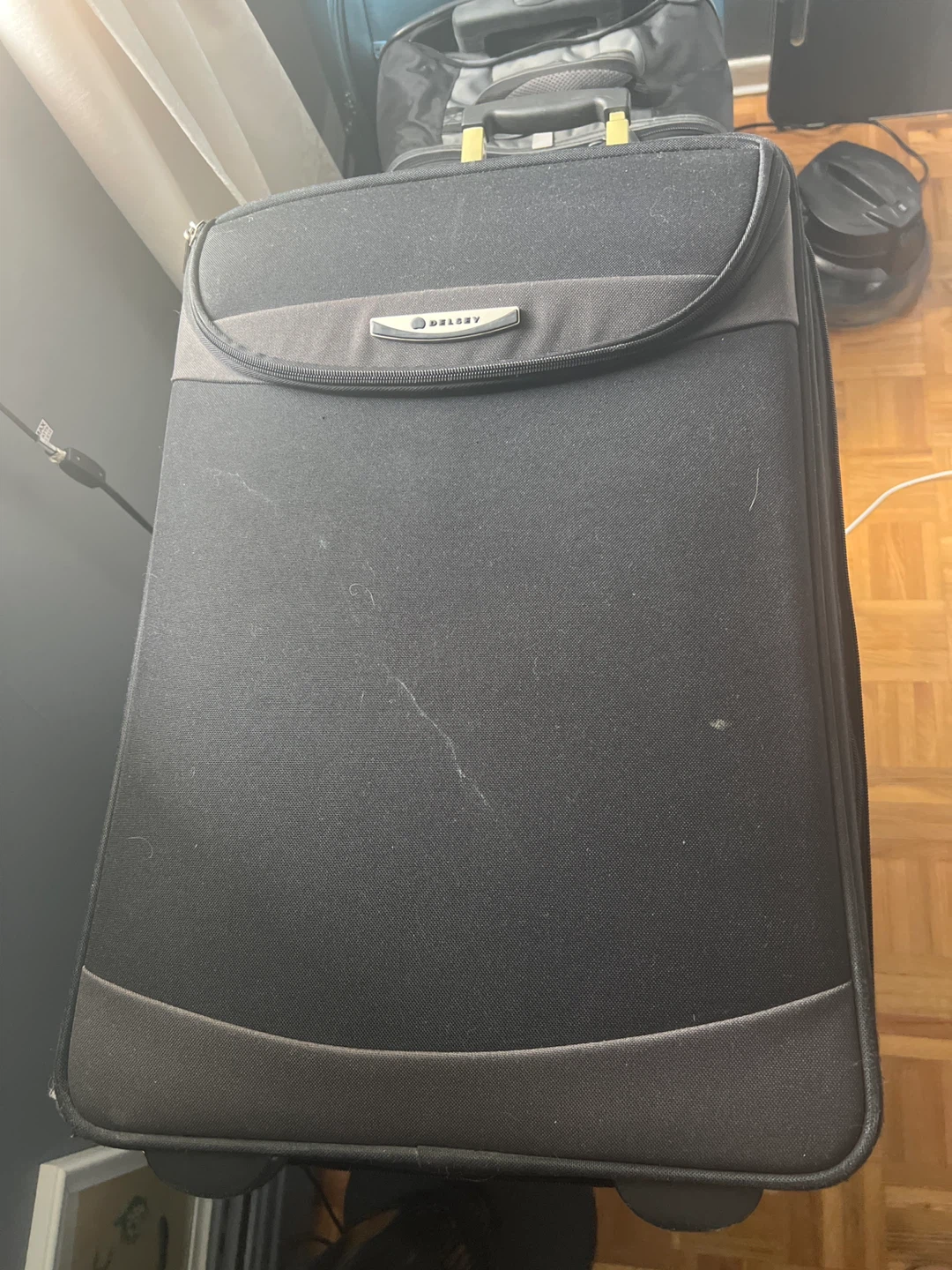 Delsey Black Rolling Suitcase