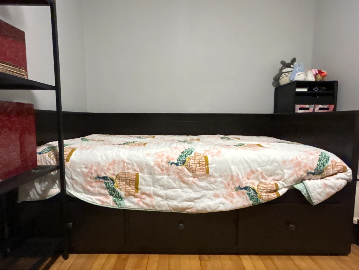Dark Brown Daybed with Storage Drawers and Peacock Quilt