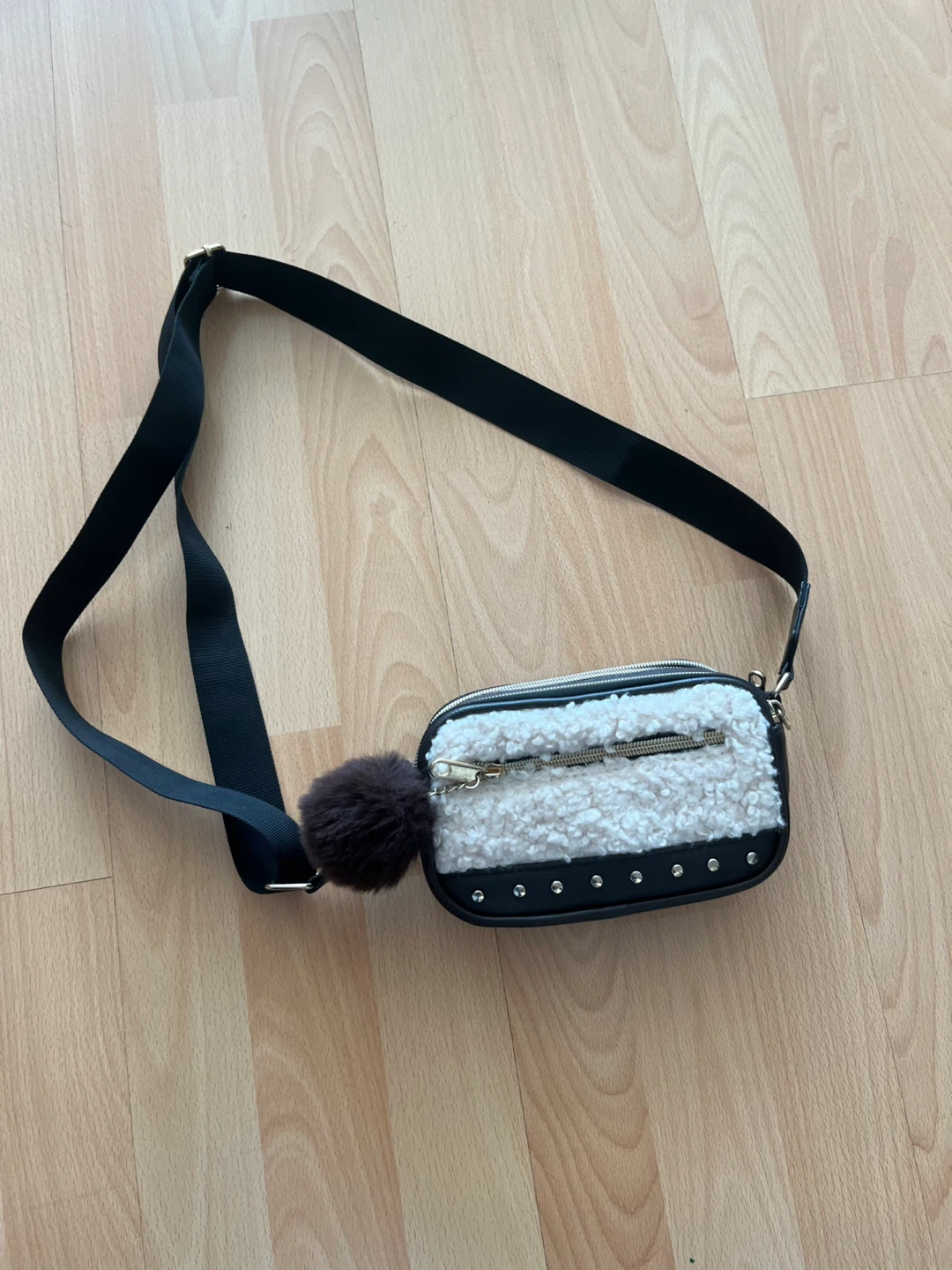 Claire’s purse with fluffy front and pom pom