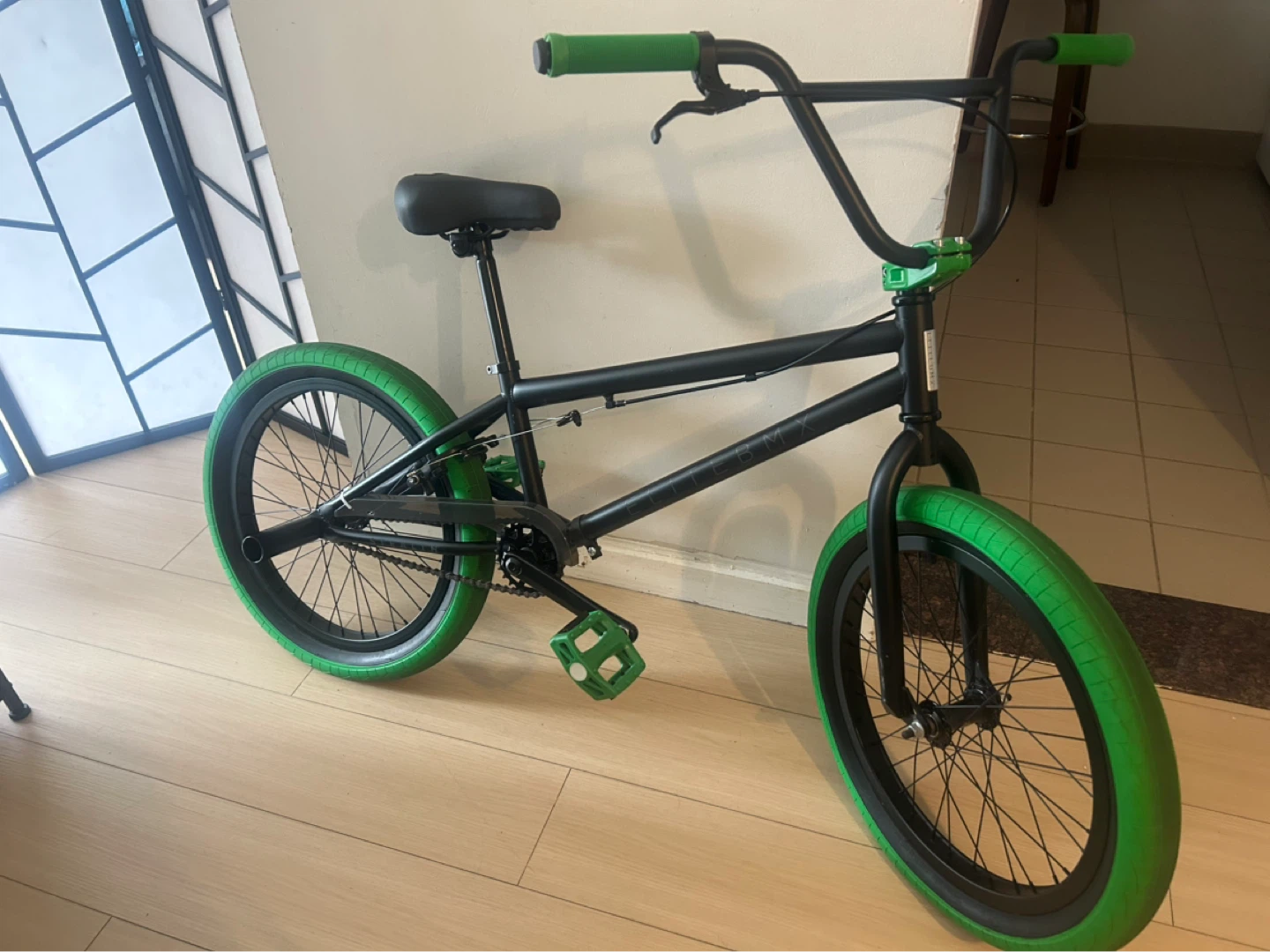 Black BMX Bike with Green Accents