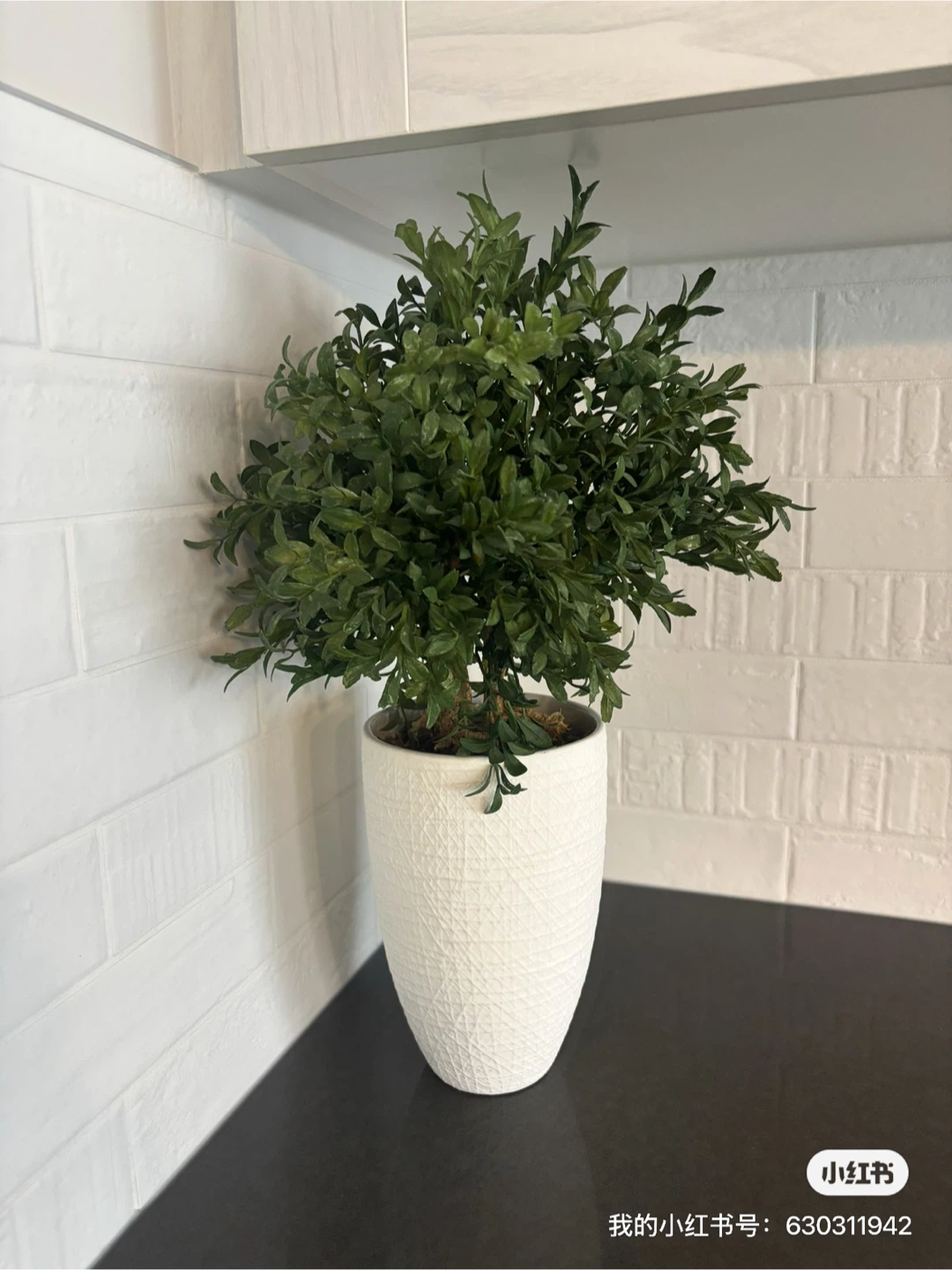 Artificial Green Plant in White Textured Pot