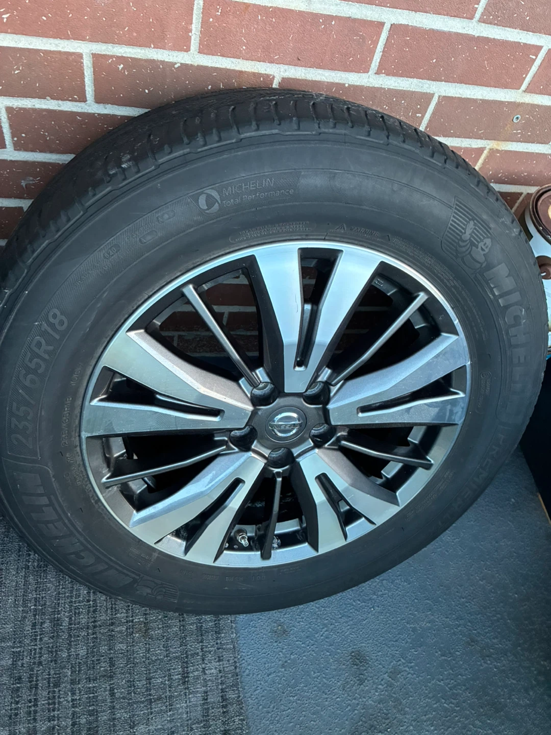 18” OEM Nissan pathfinder rims and all season tires