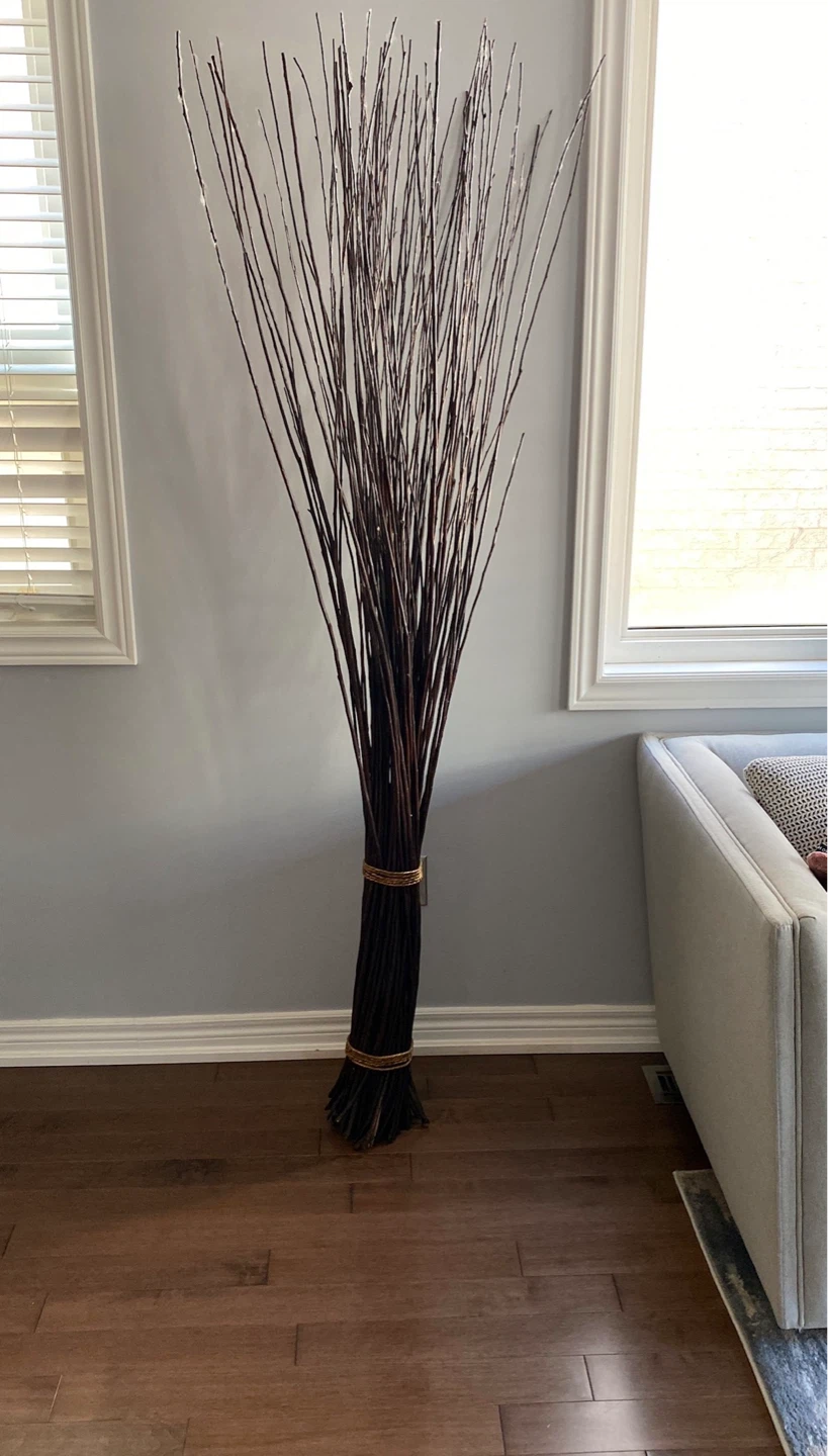 Tall decorative branches with gold tie