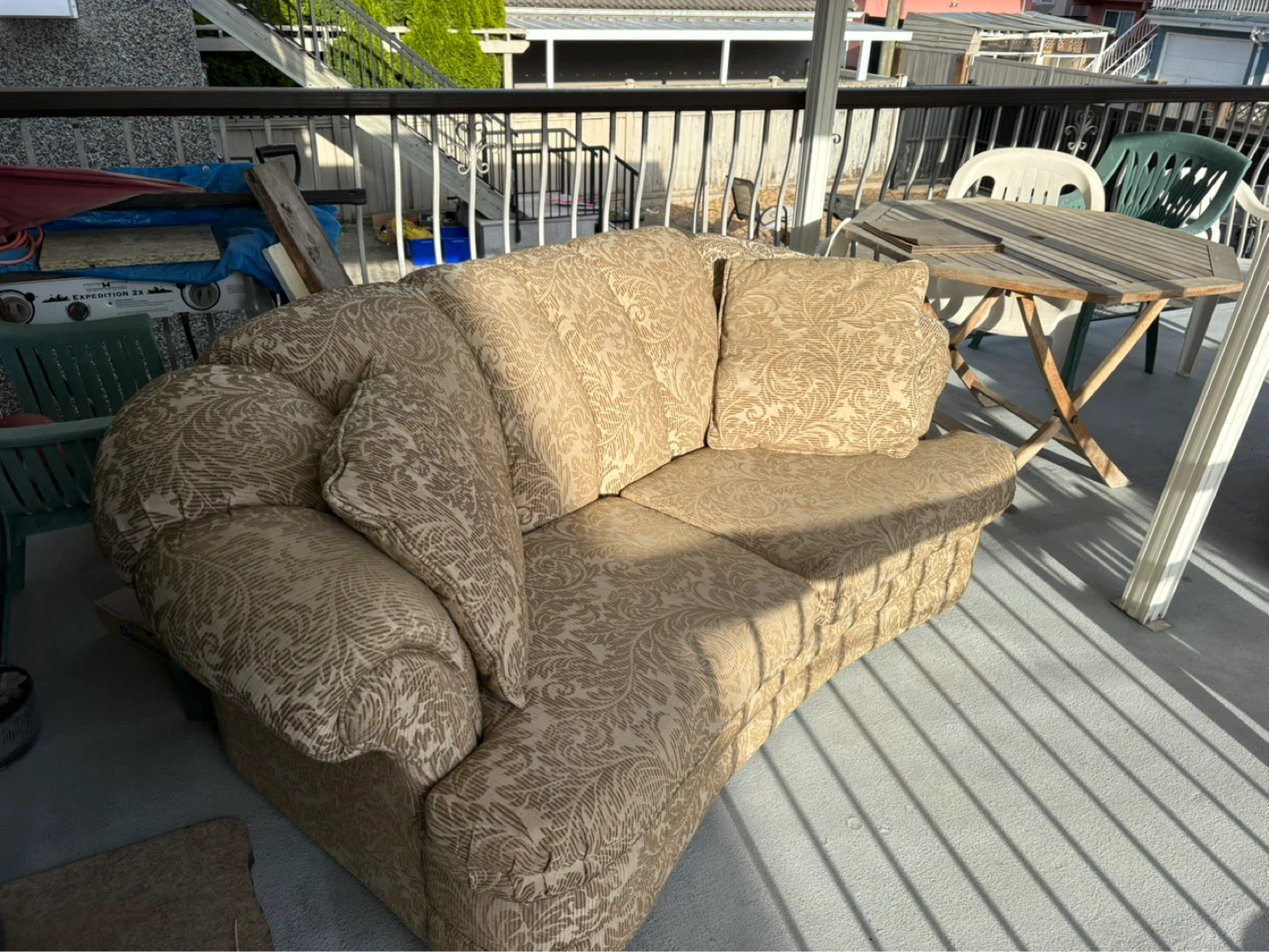 Tan floral patterned loveseat and Arm Chair