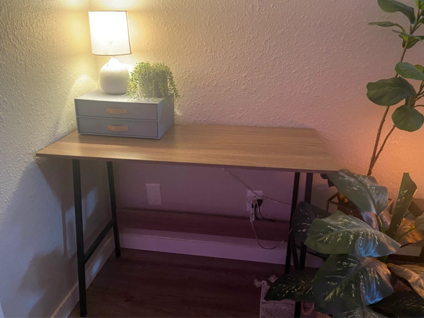 Wooden desk with black legs