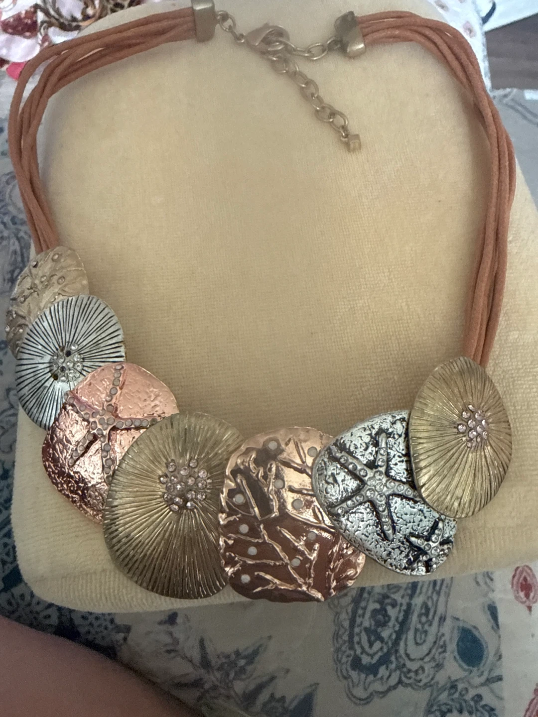 Multi-tone pendant necklace with faux suede cord
