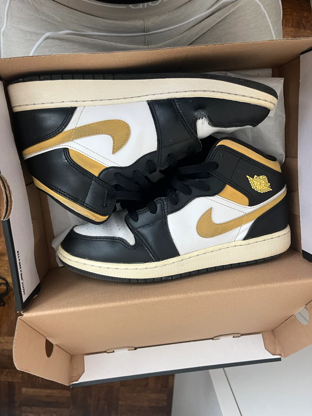 Air Jordan 1 Mid Black White Gold Sneakers
