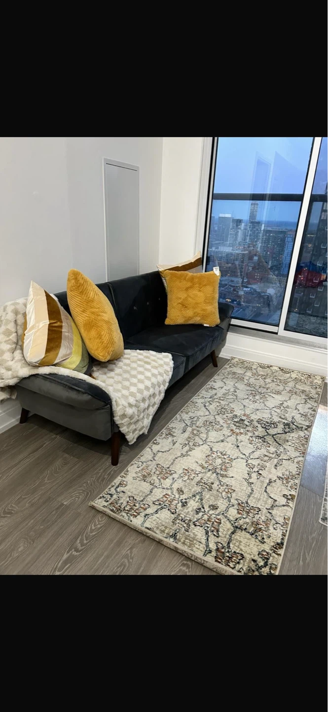 Grey Tufted Sofa with Wooden Legs