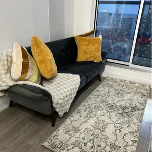 Grey Tufted Sofa with Wooden Legs