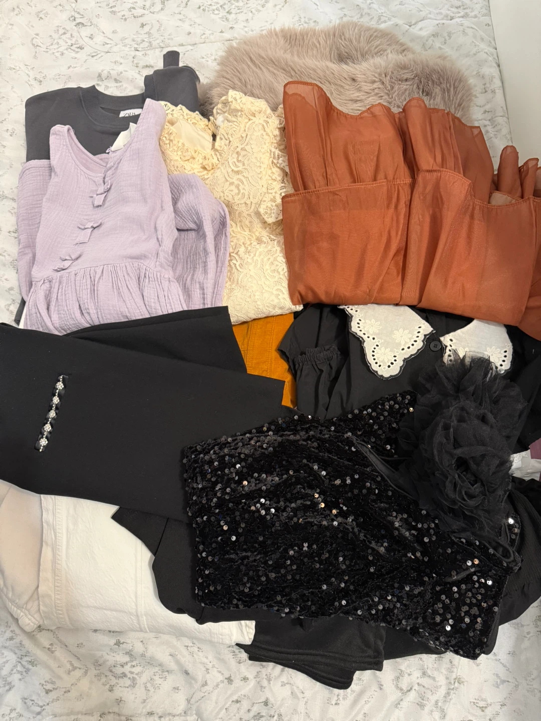 Bundle of girls' clothing - jackets, tops, and jumpsuits