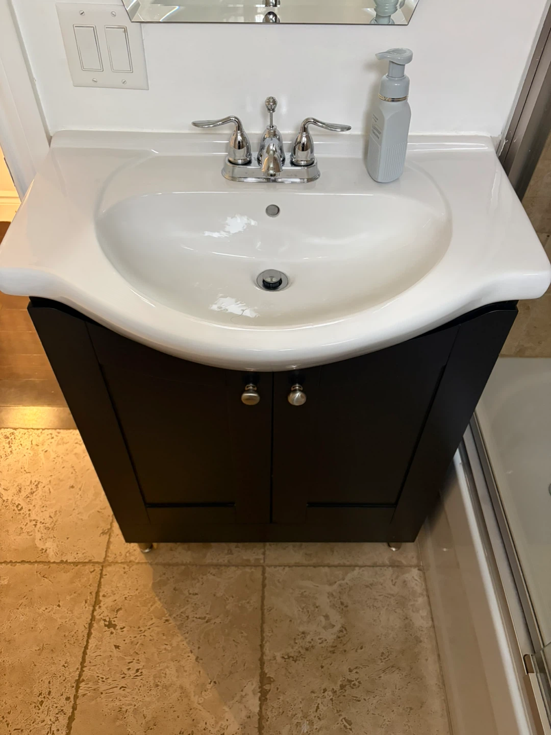 White Vanity Sink with Black Cabinet