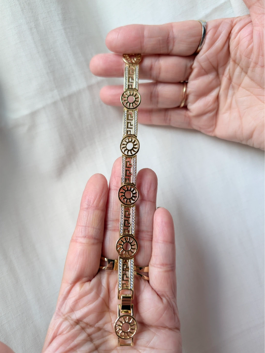 Gold laminated bracelet with sun and Greek key design - photo 3