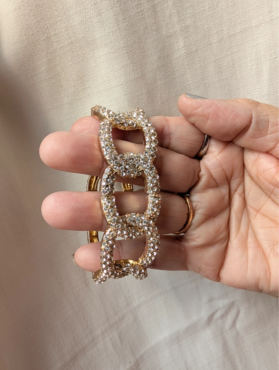 Gold tone link bracelet with rhinestones