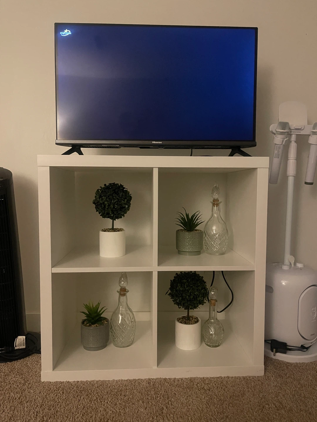 Hisense Television with White Storage Shelf/Stand
