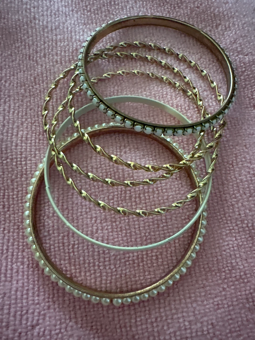 6 gold tone bangles with pearls and white accents