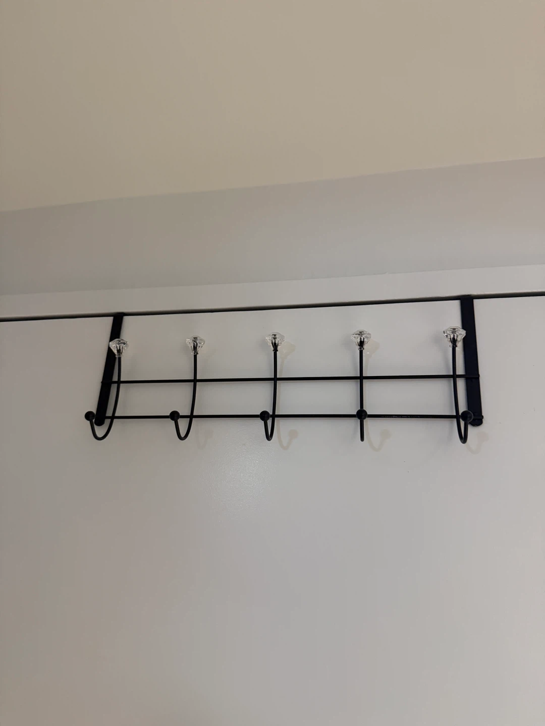 Black Metal Over-the-Door Hook Rack with Clear Knobs