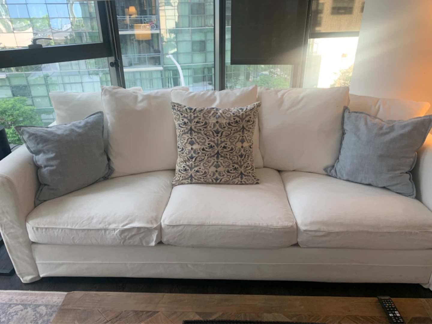 White Upholstered Sofa and Ottoman Set