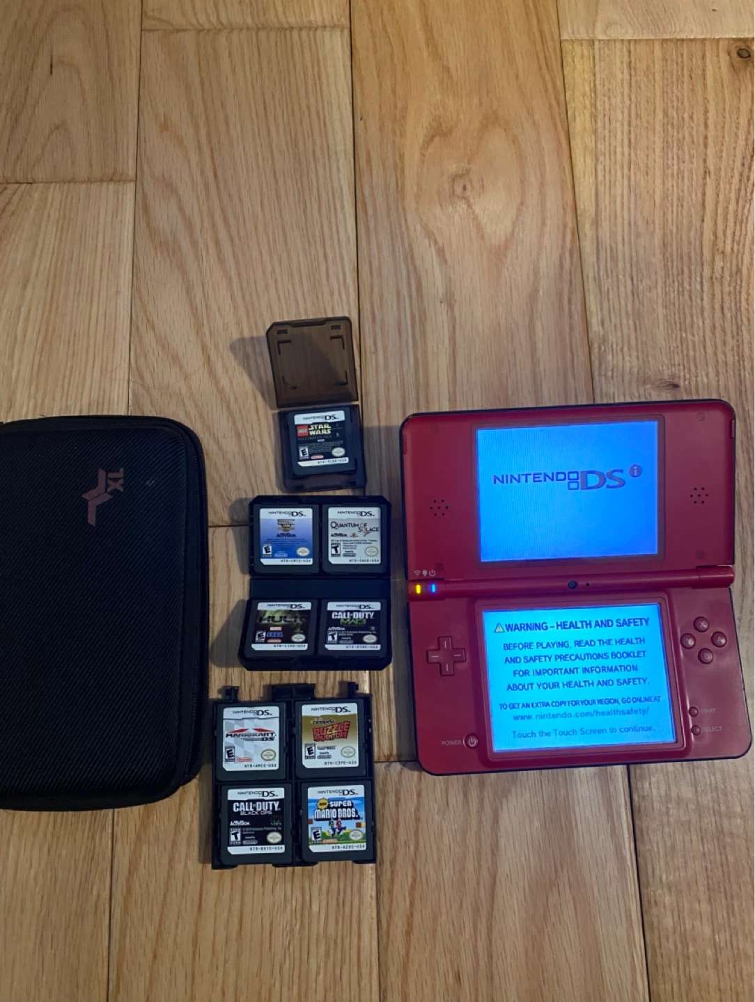 Red Nintendo DS XL Super Mario Bros. 25th Anniversary Edition