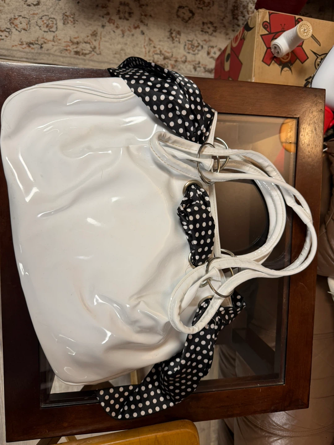 White patent leather-like tote bag with polka dot scarf accents