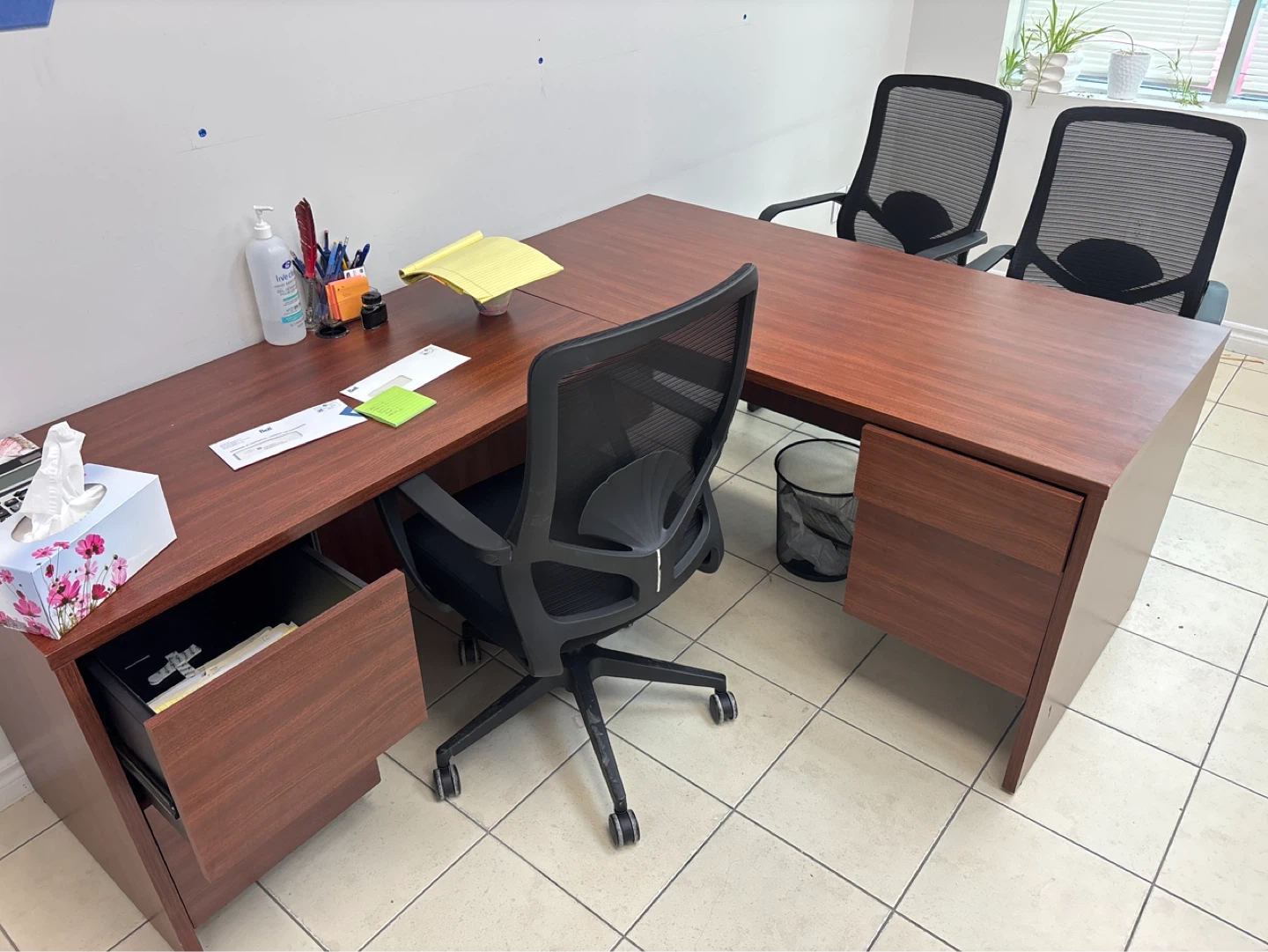 L-shaped office desk with chairs