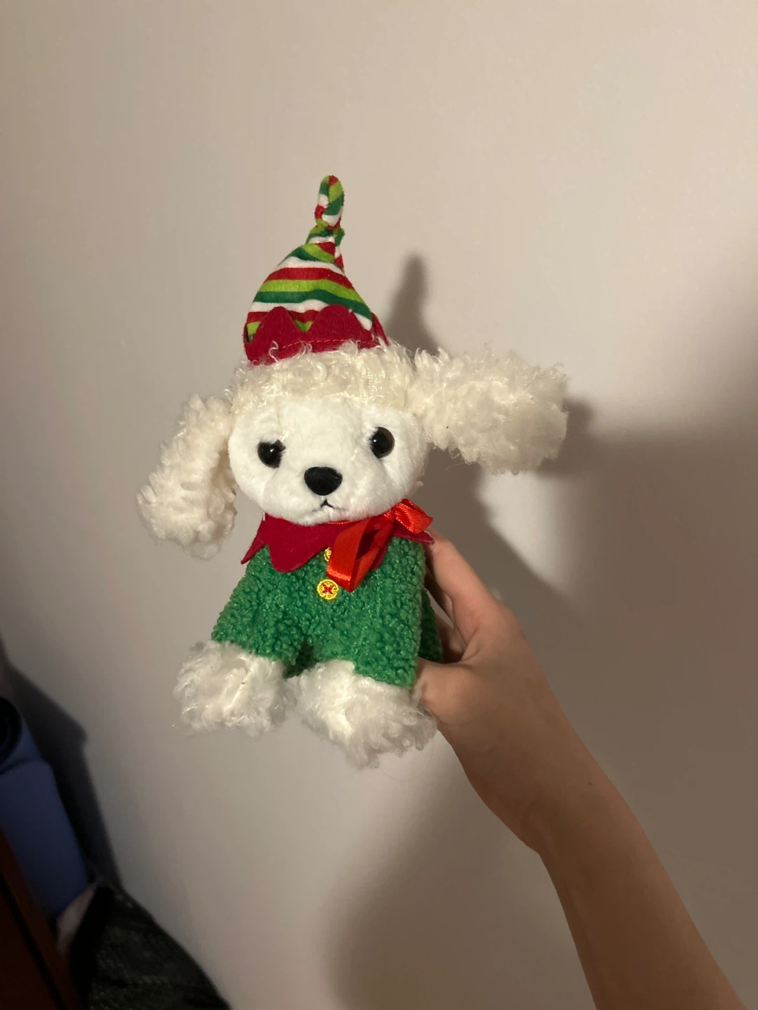 Plush dog toy dressed as an elf