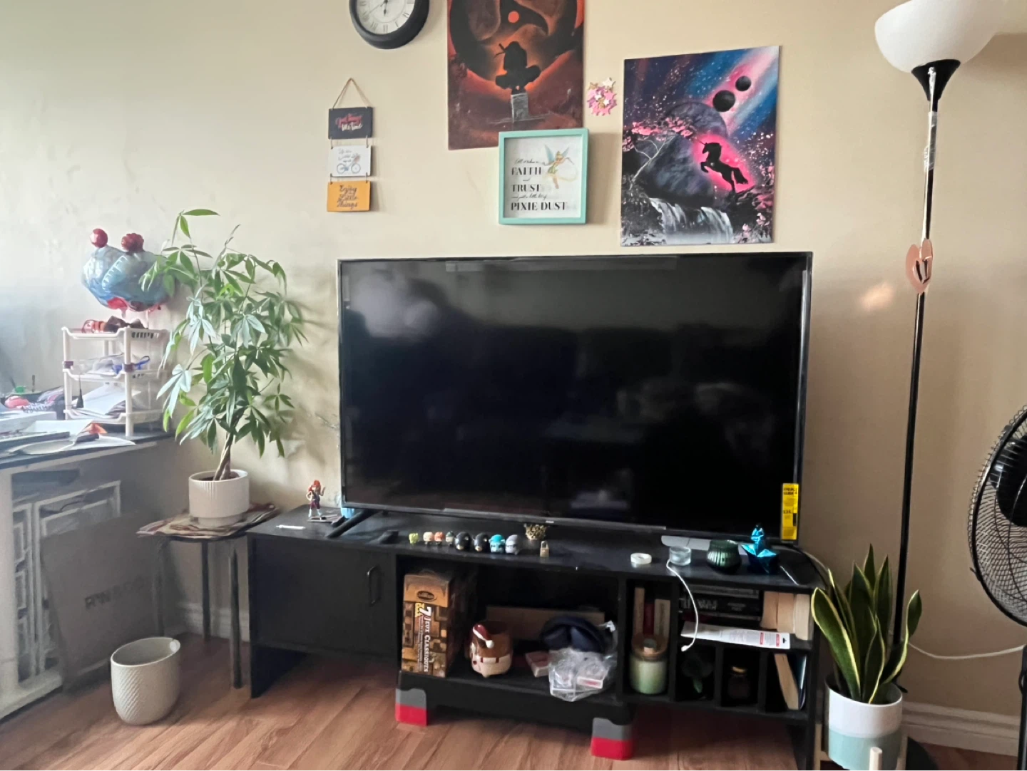 Black RCA TV along with stand - Moving sale
