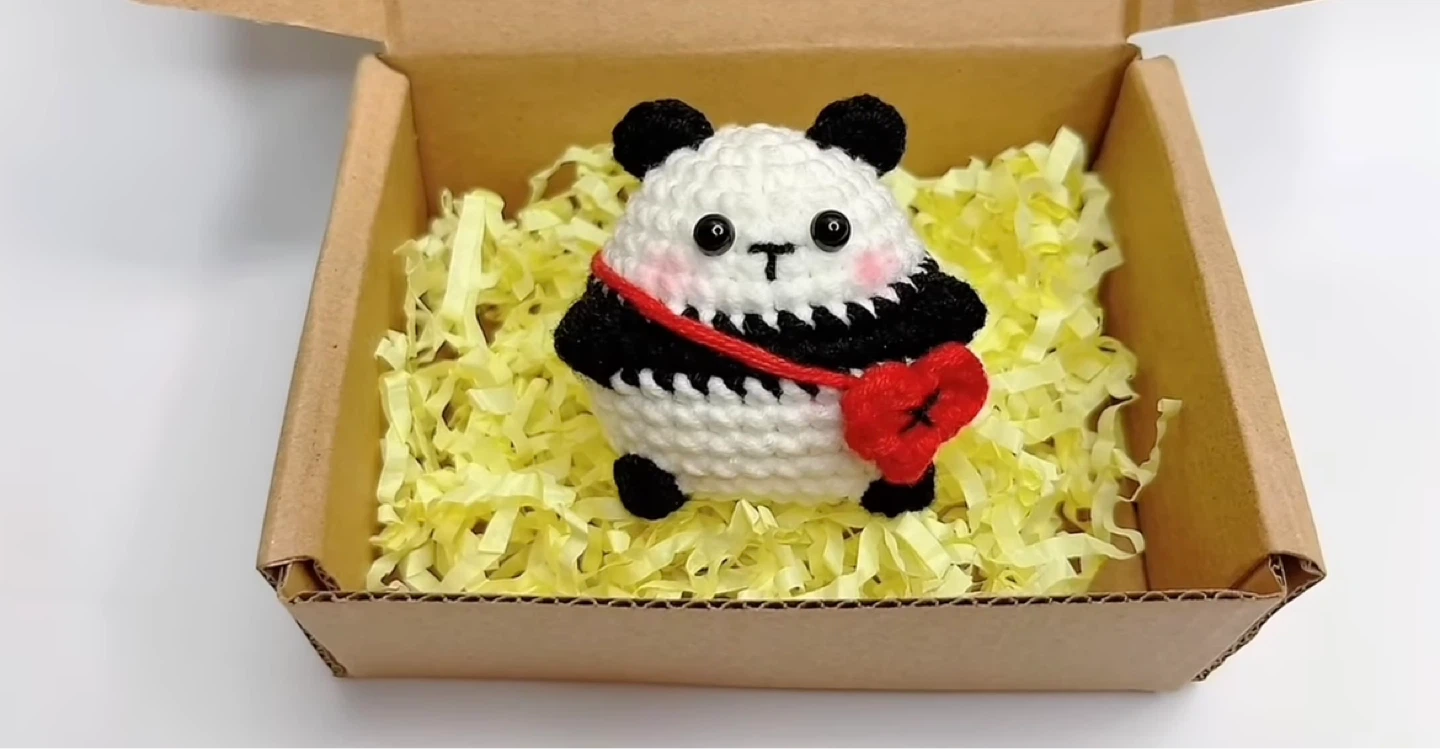Hand-knitted Panda Plushie with Heart Charm