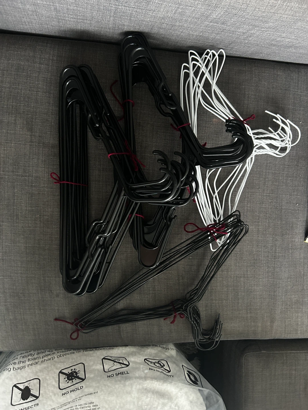 Bundle of Black and White Clothes Hangers