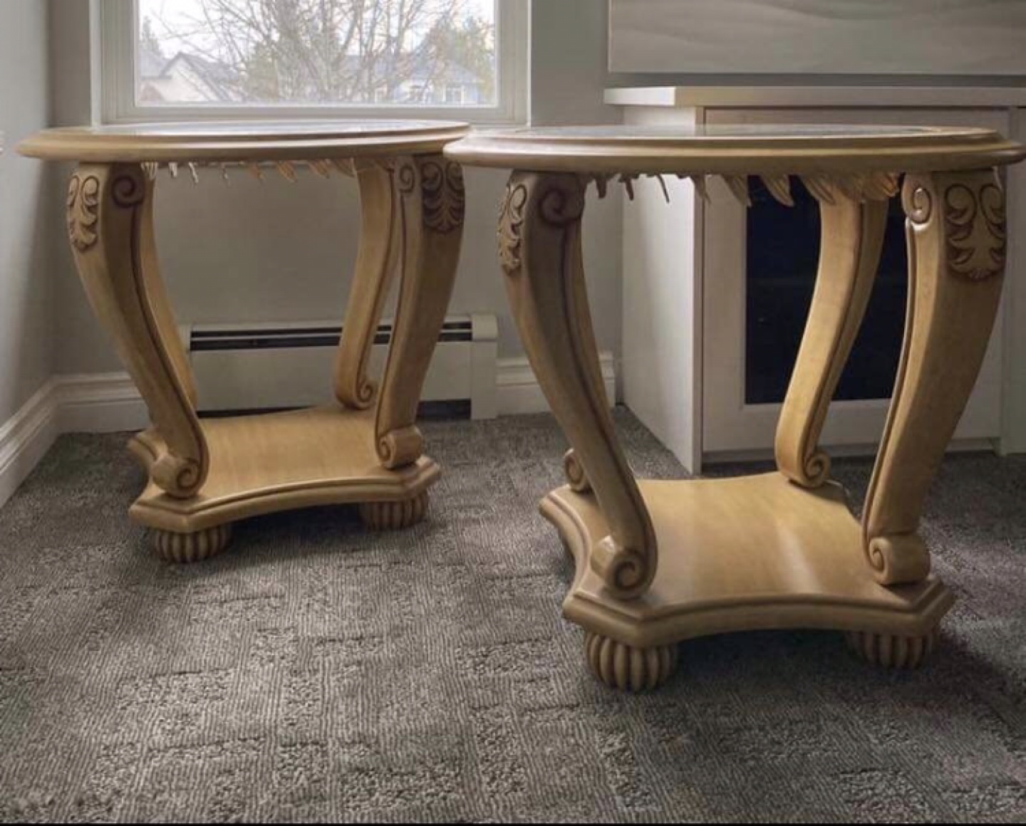 Pair of ornate wooden accent tables with glass tops $225