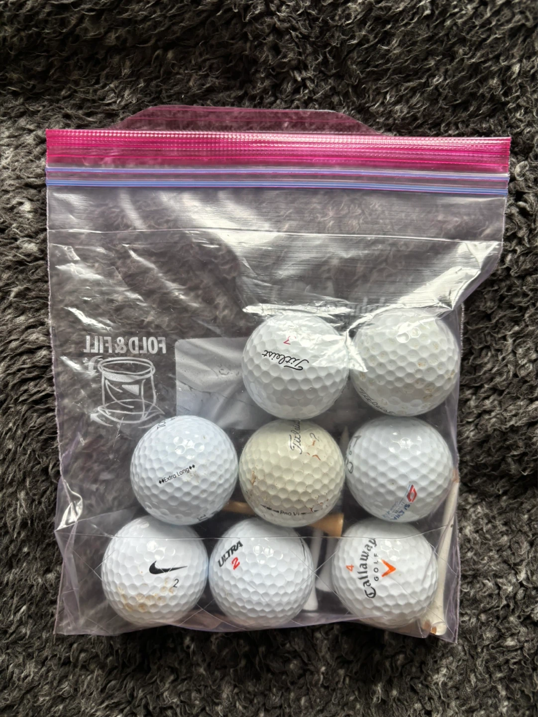 Assorted Golf Balls and Tees