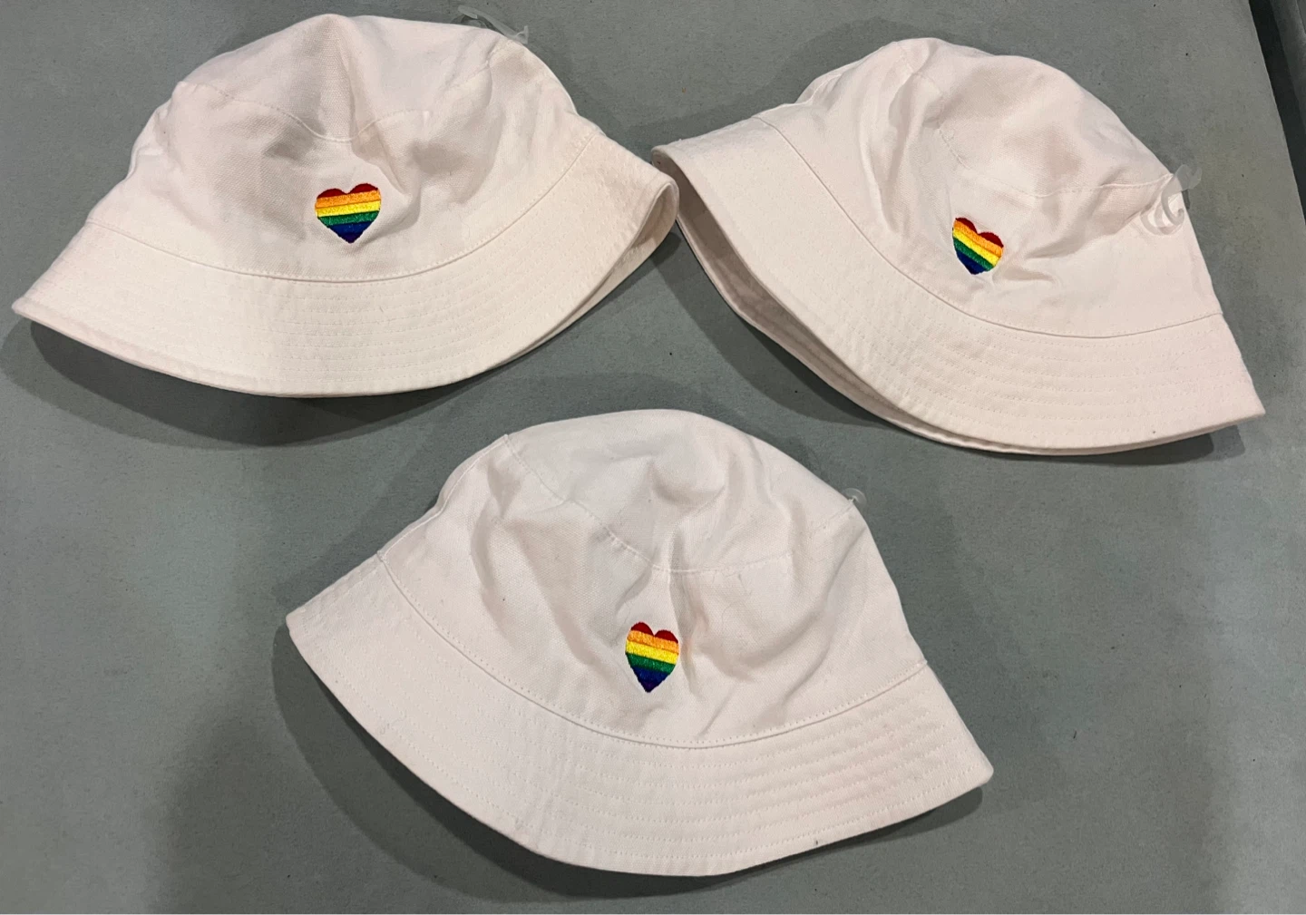 NEW — $5 each White Bucket Hats with Rainbow Heart