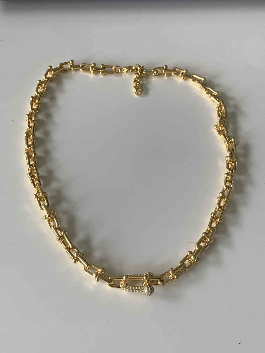 Gold plated tone chain necklace with pave clasp