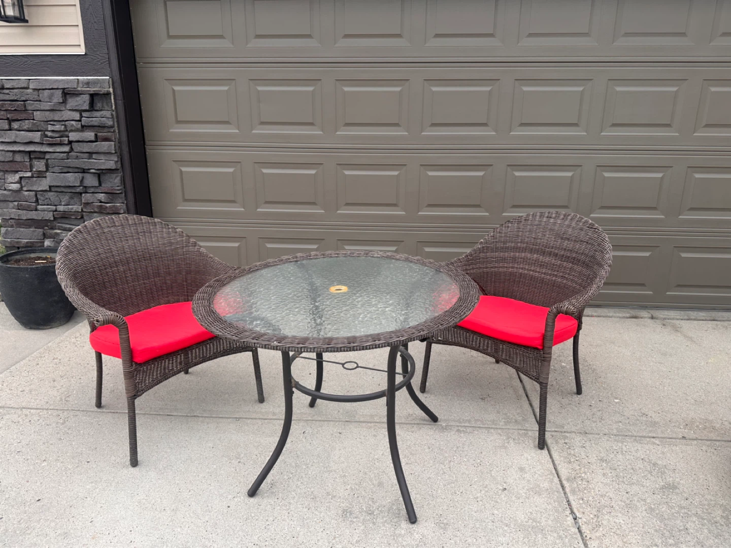 Wicker patio set with glass top table and 2 chairs