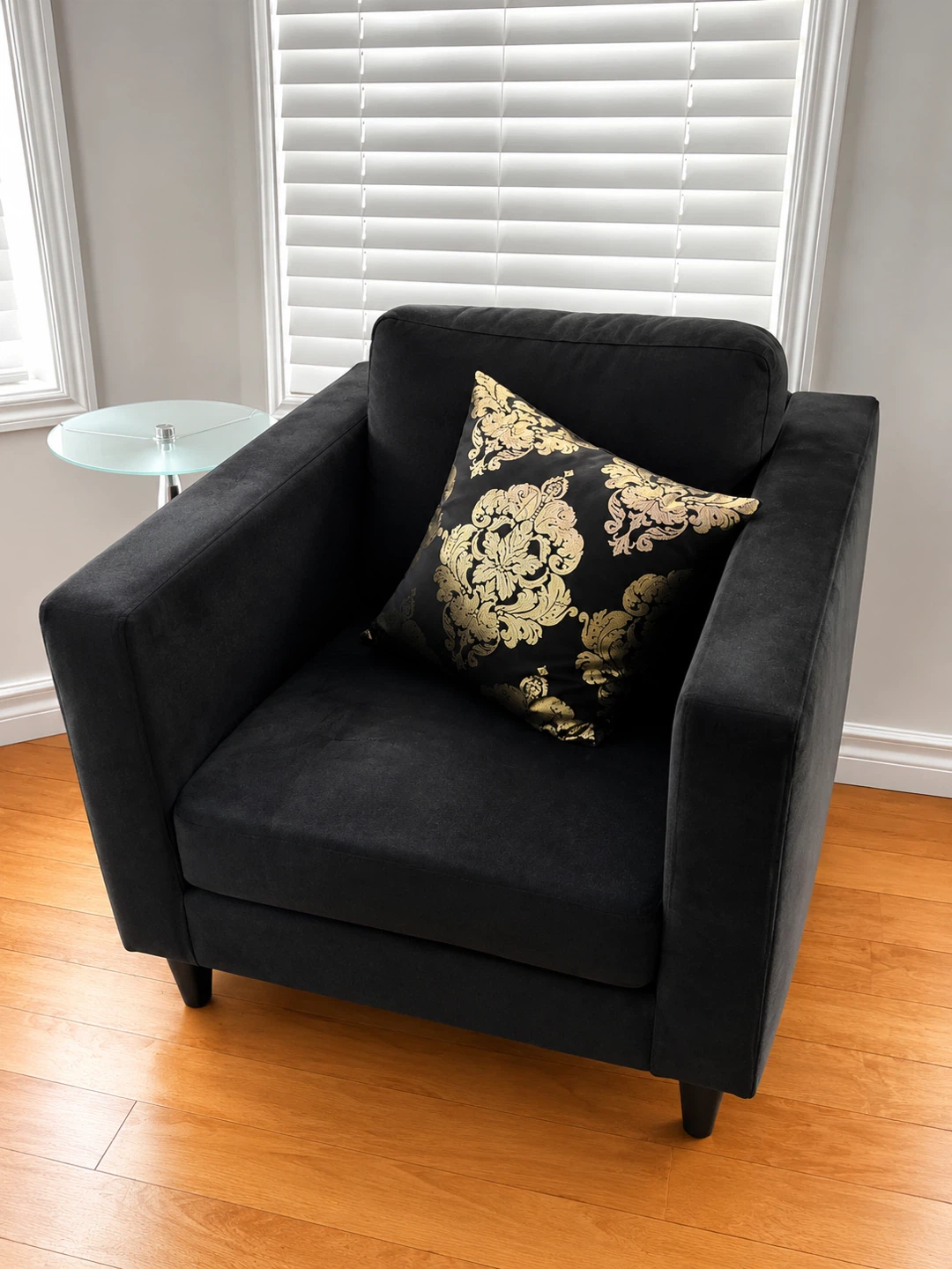 Black Accent Chair with Black and Gold Damask Pillow