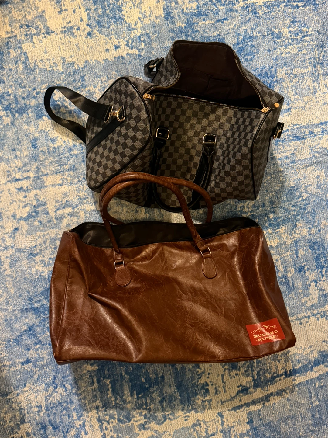 Brown Faux Leather Duffel Bag and Checkered Weekender Bag
