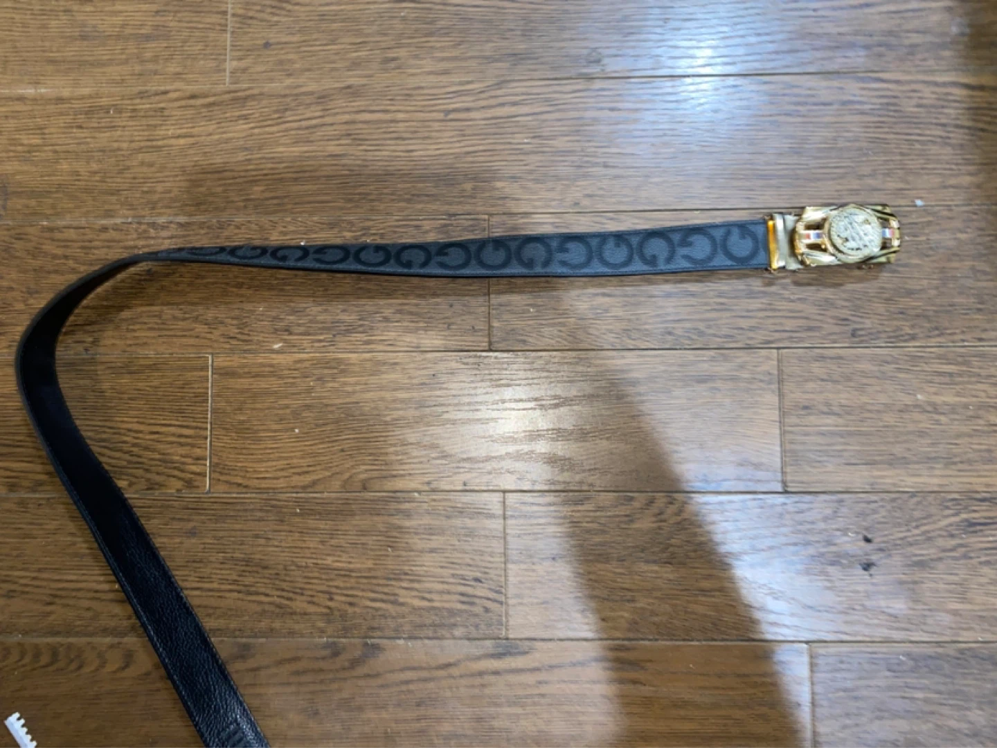 Black belt with GG pattern and gold buckle