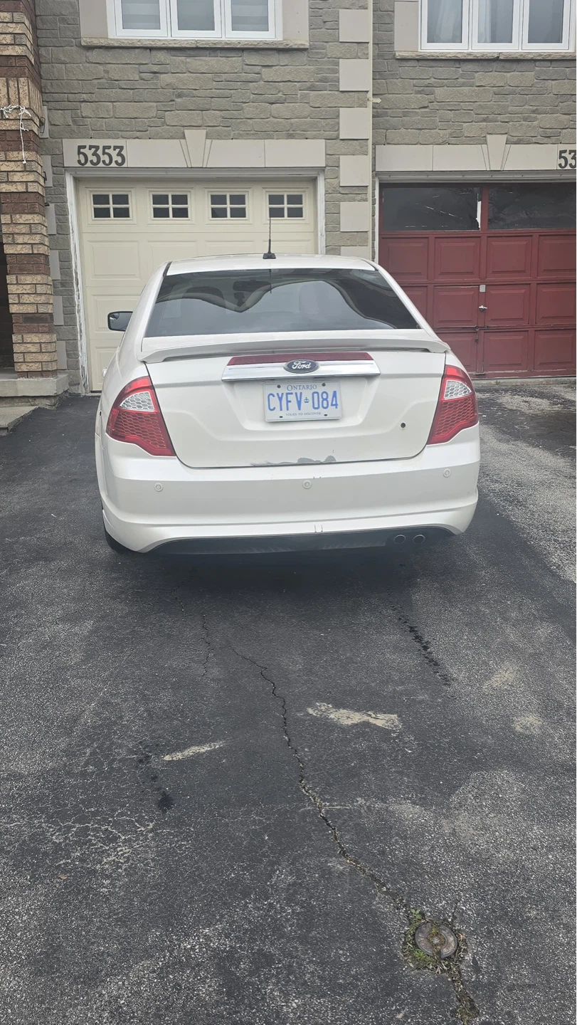 White Ford Fusion Sedan