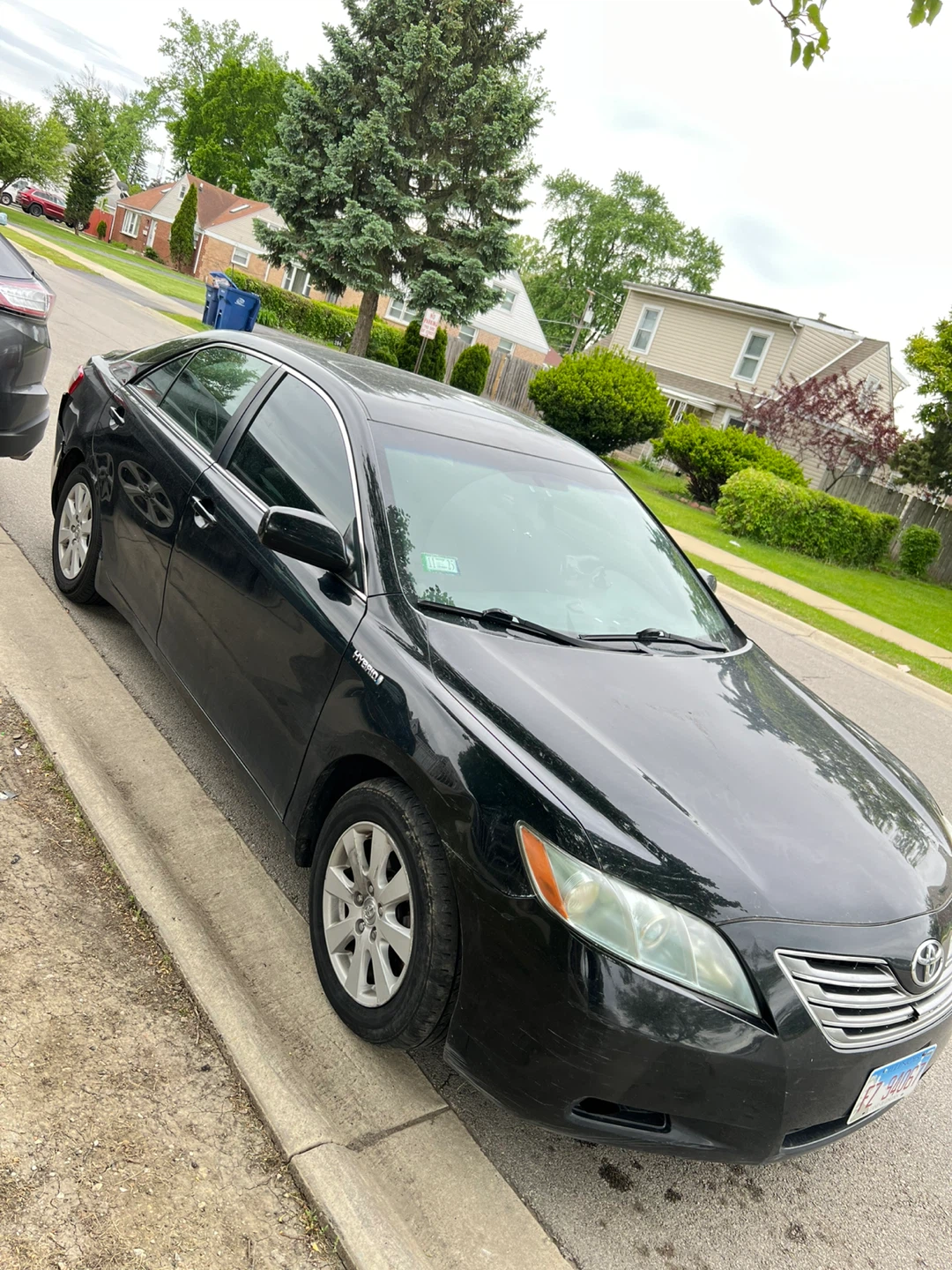 Black Toyota Camry Hybrid Sedan
