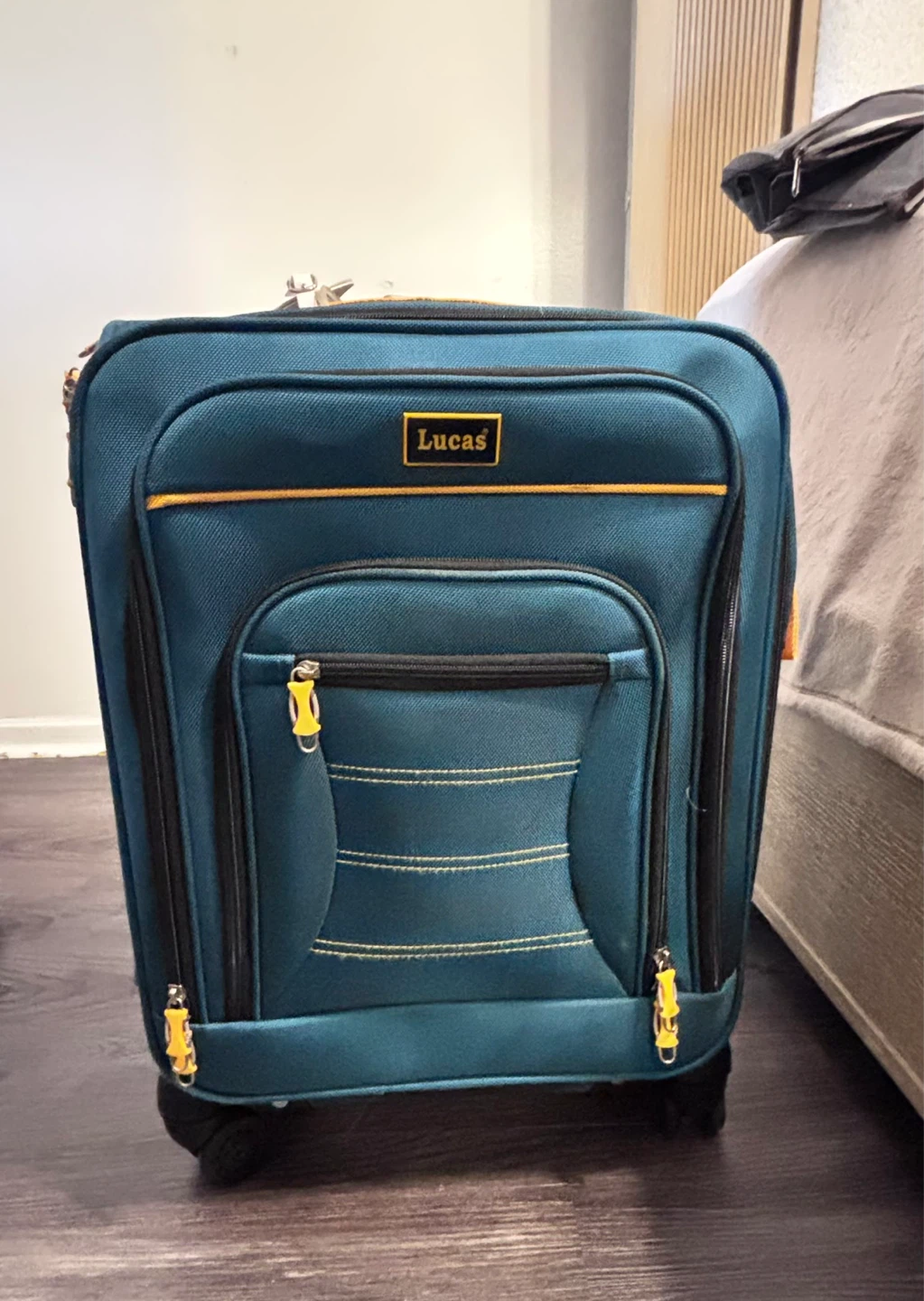 Lucas "Designed in USA" Teal Rolling Suitcase