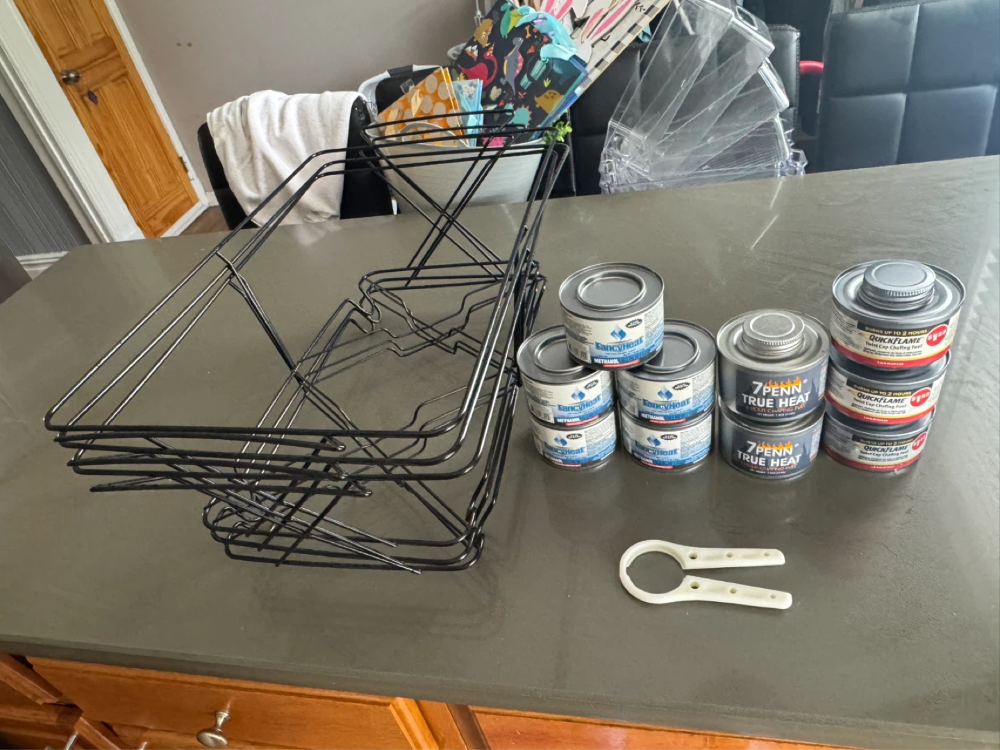 3 black wire chafer stands & 10 fuel cans